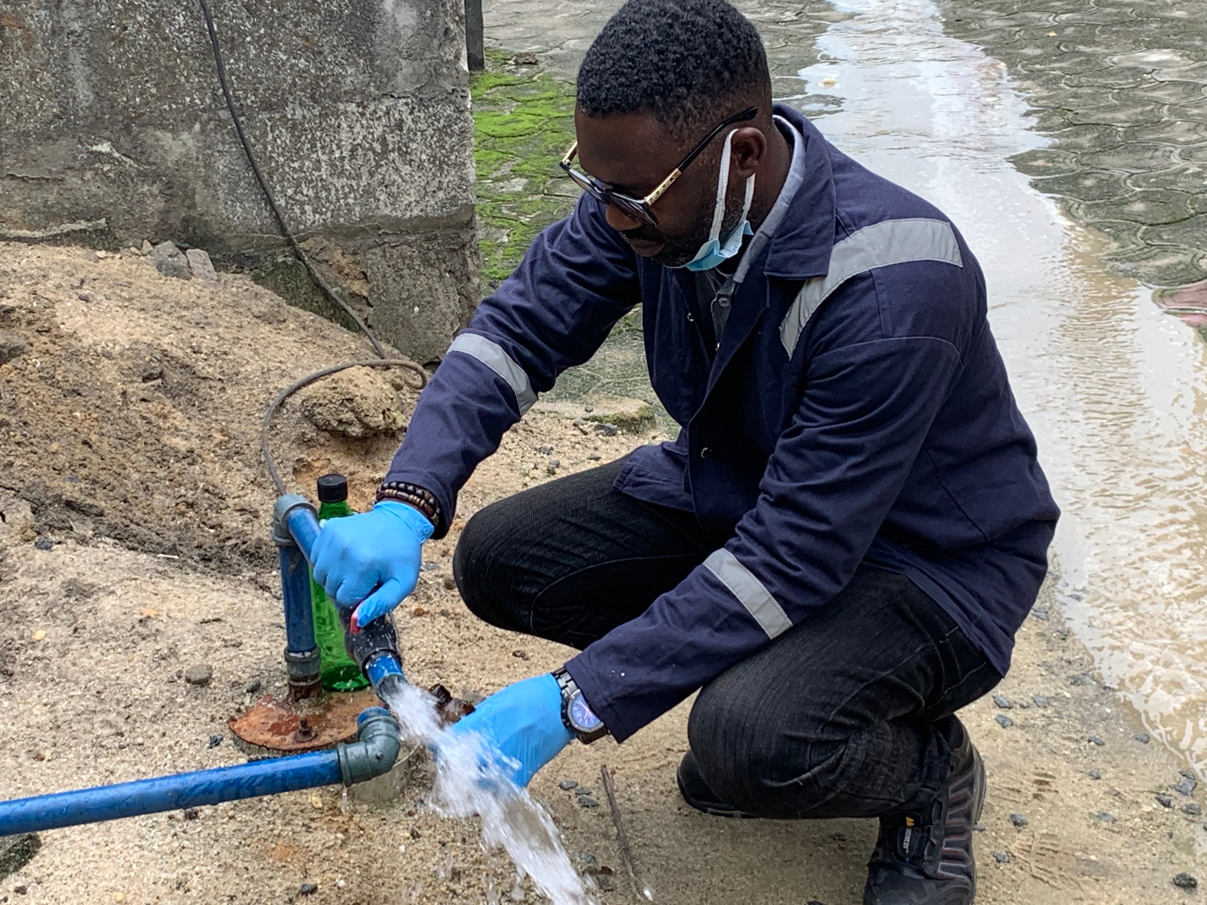 Field worker checking water infrastructure